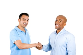 Closeup portrait of two men shaking hands, after a conflict resolution, and finding a solution to a problem, isolated on white background with copy space. Human emotions and facial expressions.