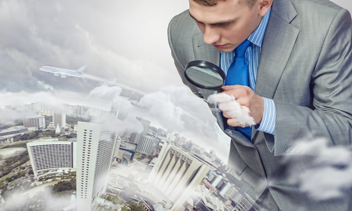 Image of businessman examining objects with magnifier-1