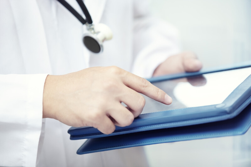 Doctor using tablet HIPAA 24By7Security